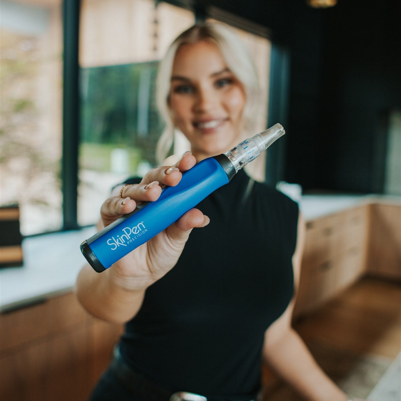 destiny holding a skinpen microneedling device at cool springs plastic surgery in brentwood